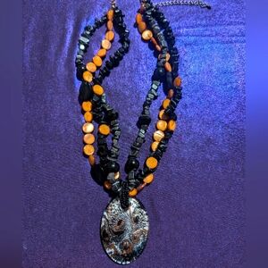 Unique black/caramel beaded necklace with Italian Glass Pendant.